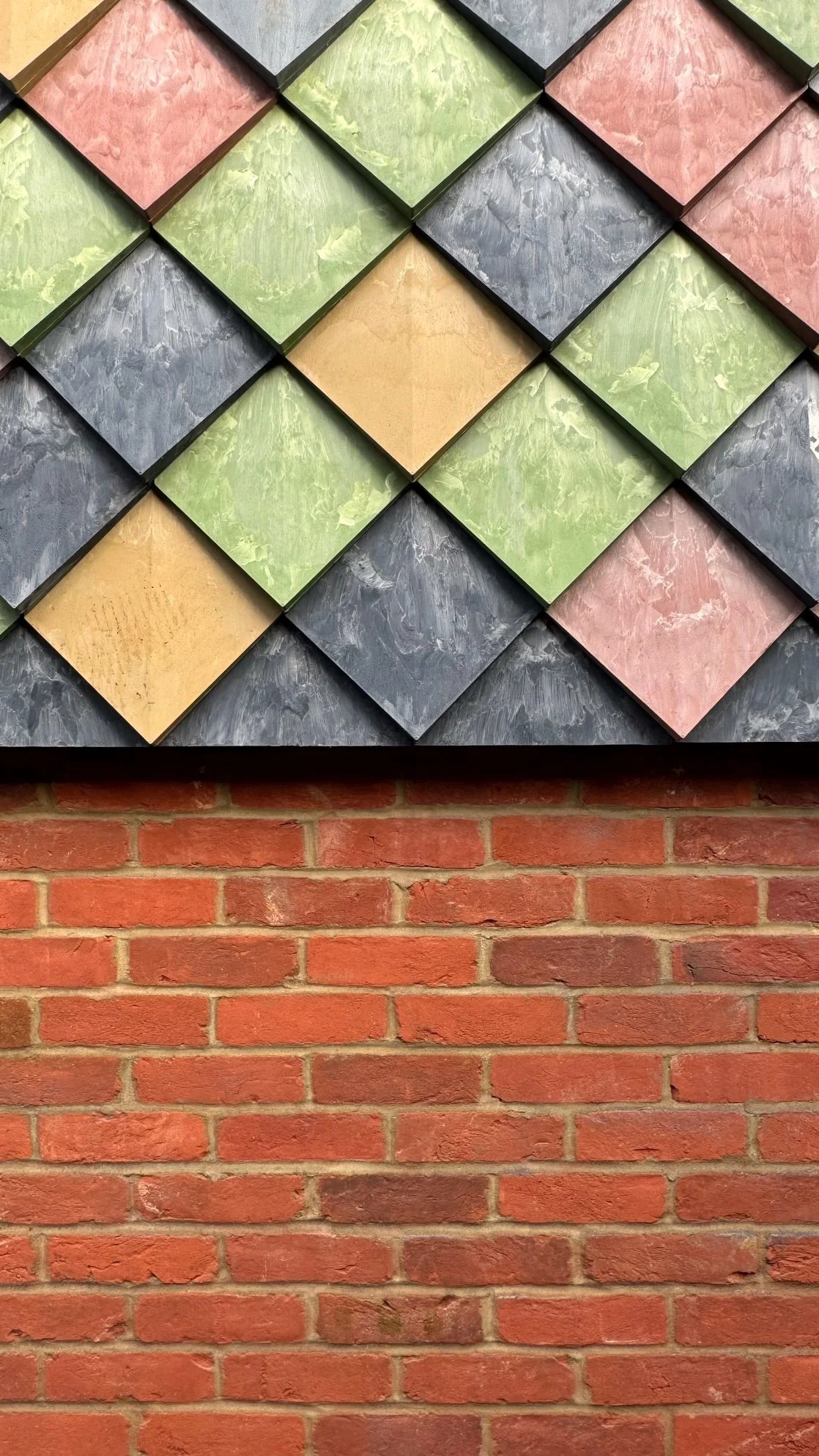 Detail of Pretty Plastic façade tile installation on a modern home extension – lightweight, low-maintenance, and fully recycled.